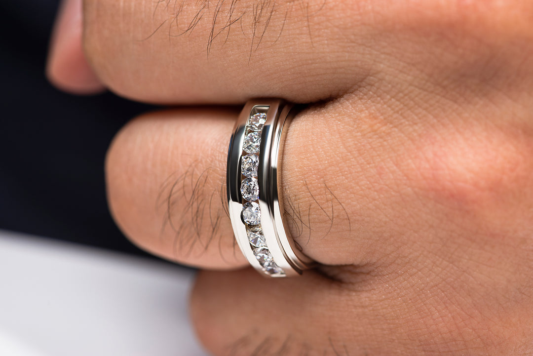 Man wearing elegant moissanite engagement ring in silver