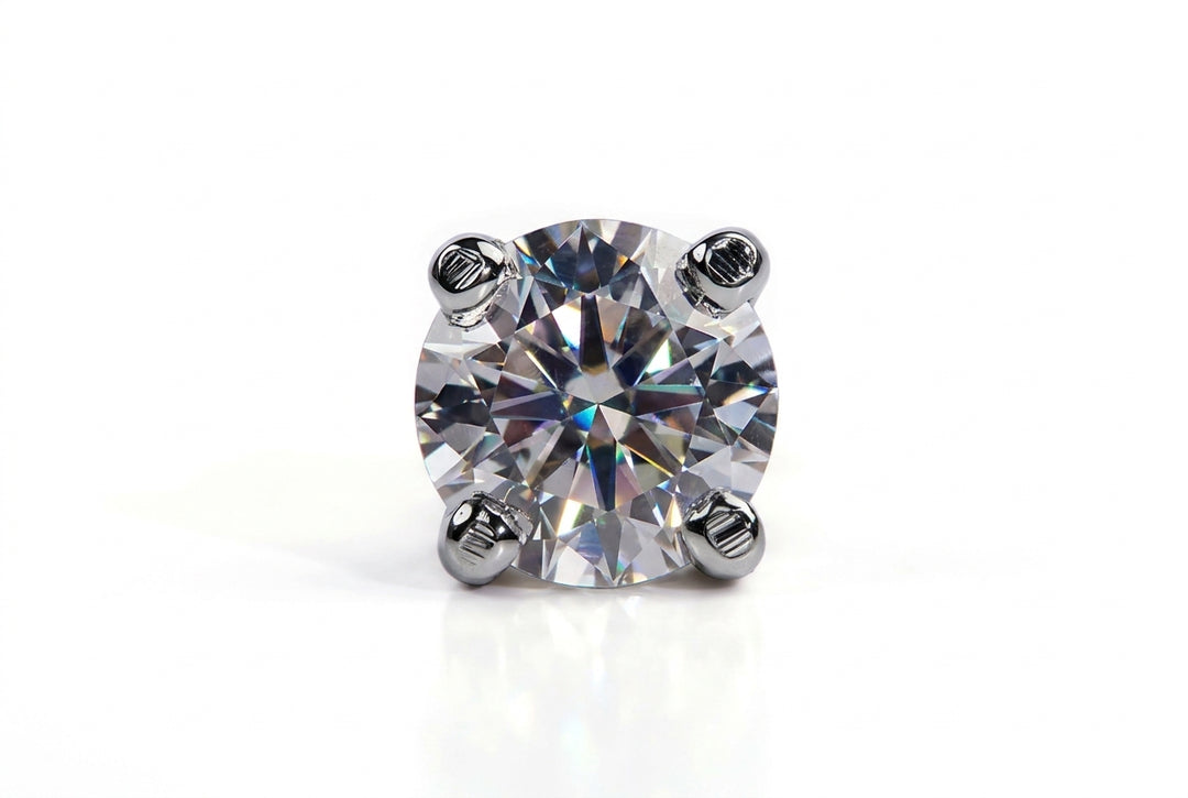 Direct front-view studio shot of a brilliant-cut round diamond stud secured with four silver prongs on a seamless white background.