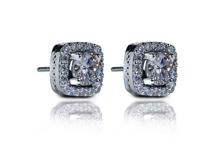 1 carat moissanite halo studs in silver over white background