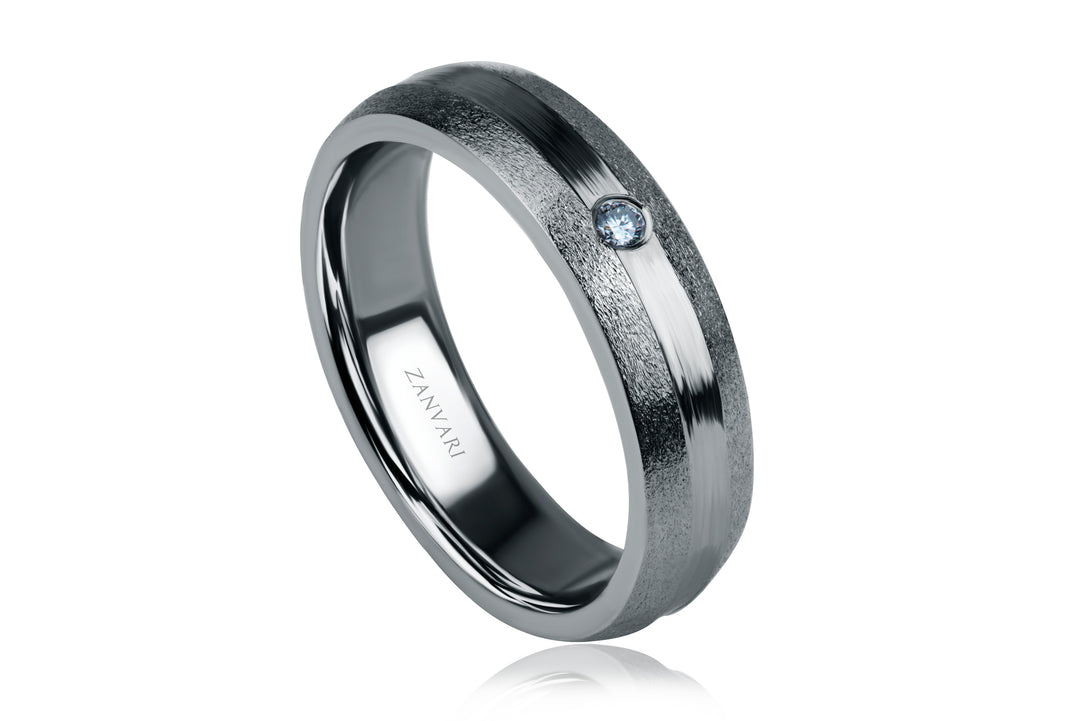 Silver ring with a diamond on a white background