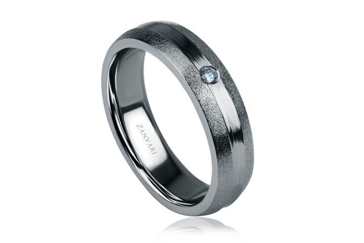 Silver ring with a diamond on a white background