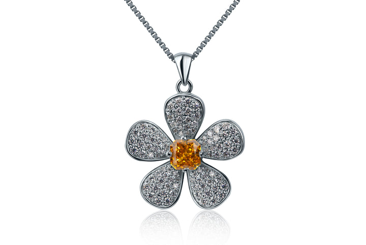 Flower-shaped silver pendant with a central orange gemstone on a white background