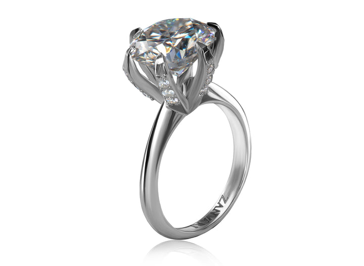 Silver ring with a large  5 carat moissanite on a white background 
