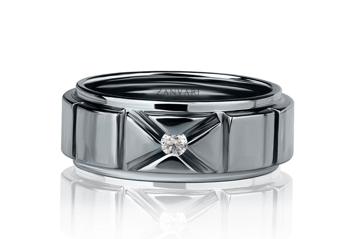 Silver ring with a diamond on a white background