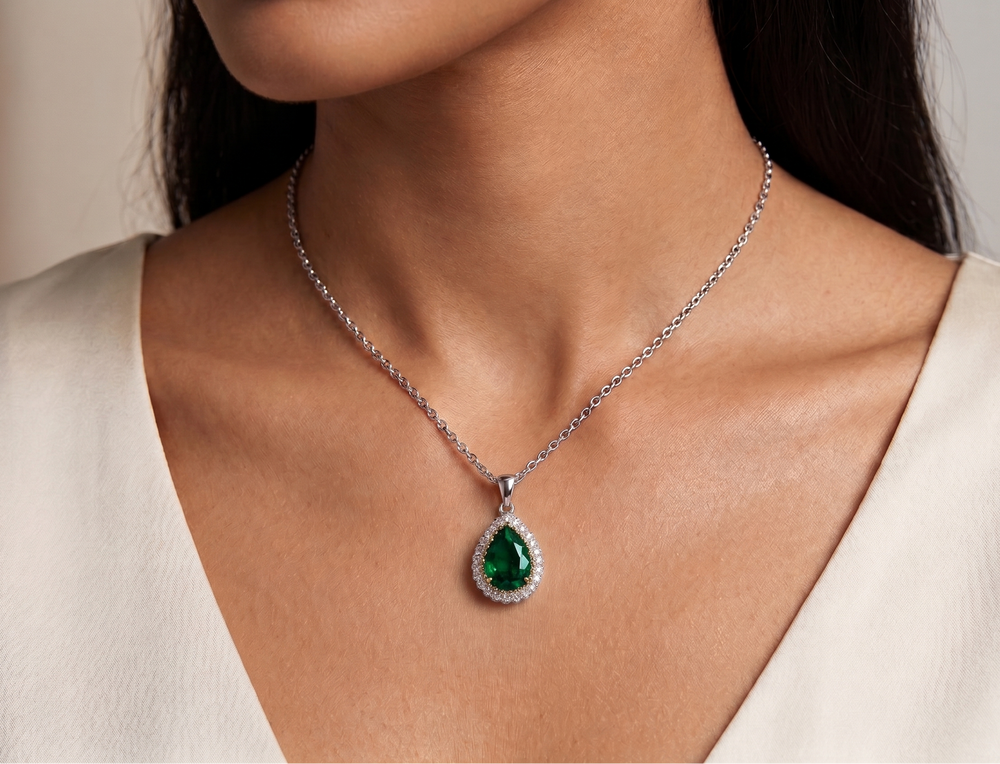 Woman wearing a necklace with a blue pendant