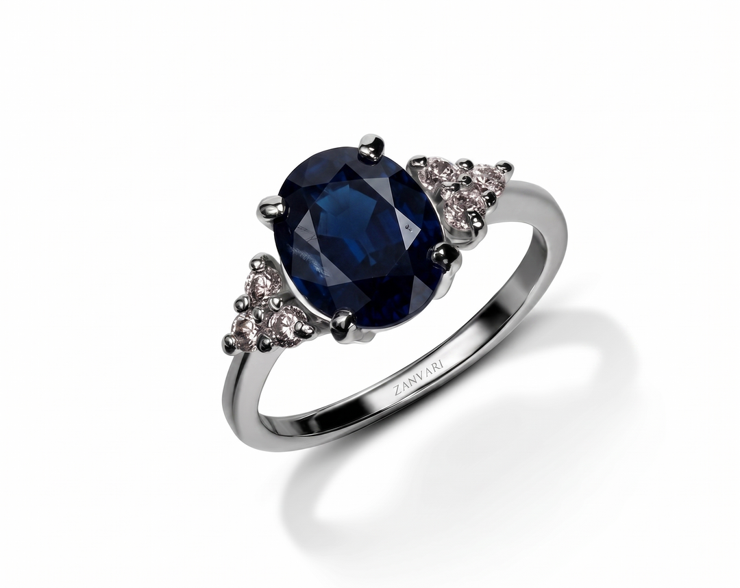 Azure Whisper Ring by Zanvari — natural sapphire oval in a prong setting with moissanite accents in 925 sterling silver, white gold plated, Pakistan.