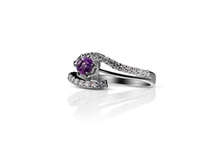 Infinity Knot Amethyst Ring by Zanvari — natural amethyst in an infinity knot setting with zirconia in 925 sterling silver with rhodium plating, Pakistan.