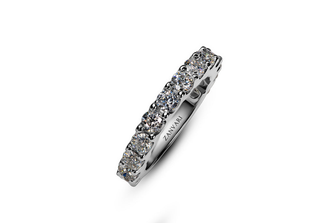 A 925 silver ring by ZANVARI, showcasing a row of sparkling Moissanite stones in a sleek, elegant band.