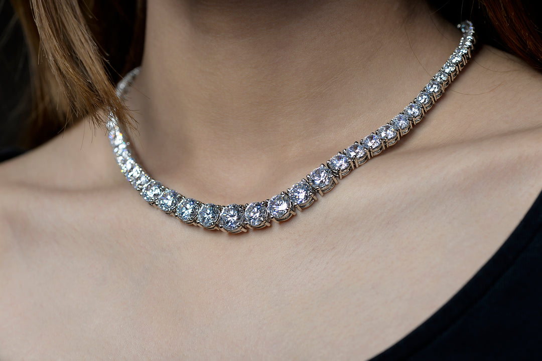 A side look of a model elegantly wearing 925 silver moissanite diamond substitute iced out necklace