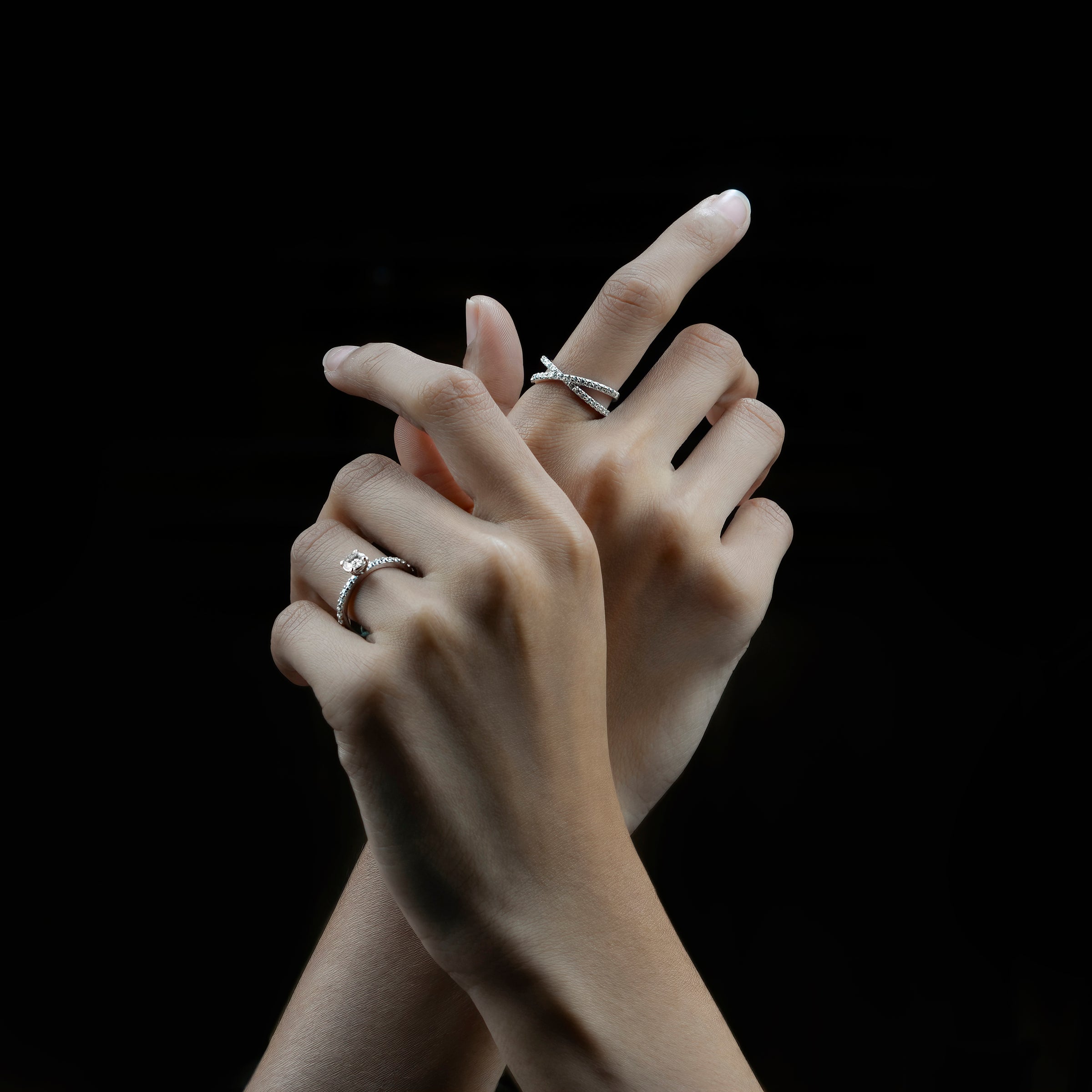Model wearing engagement moissanite rings on both of her hand gracefully