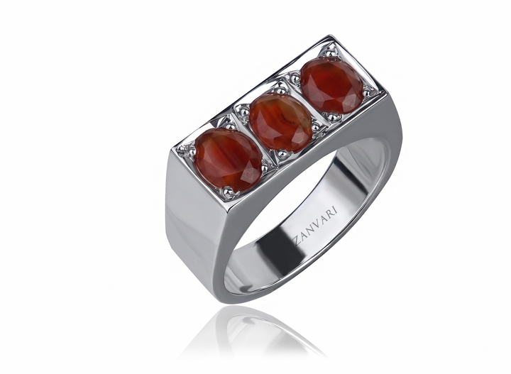 Men's 925 sterling silver ring set with three oval natural Yemeni aqeeq stones in a row, prong-set in a raised rectangular head on a wide polished band.