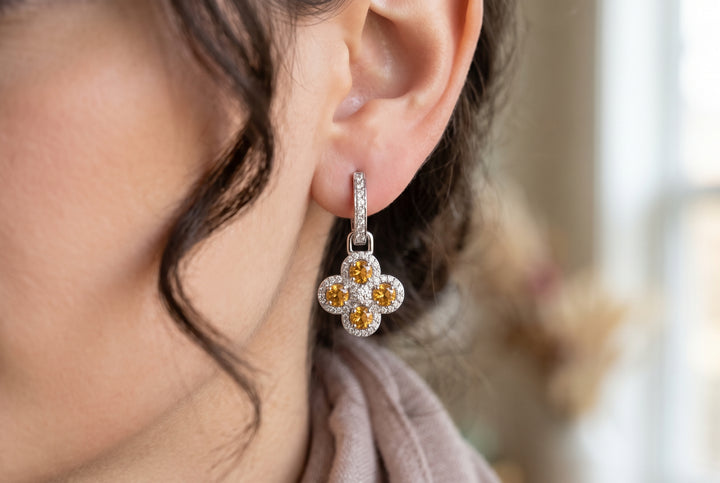Women wearing lab created citrine earrings