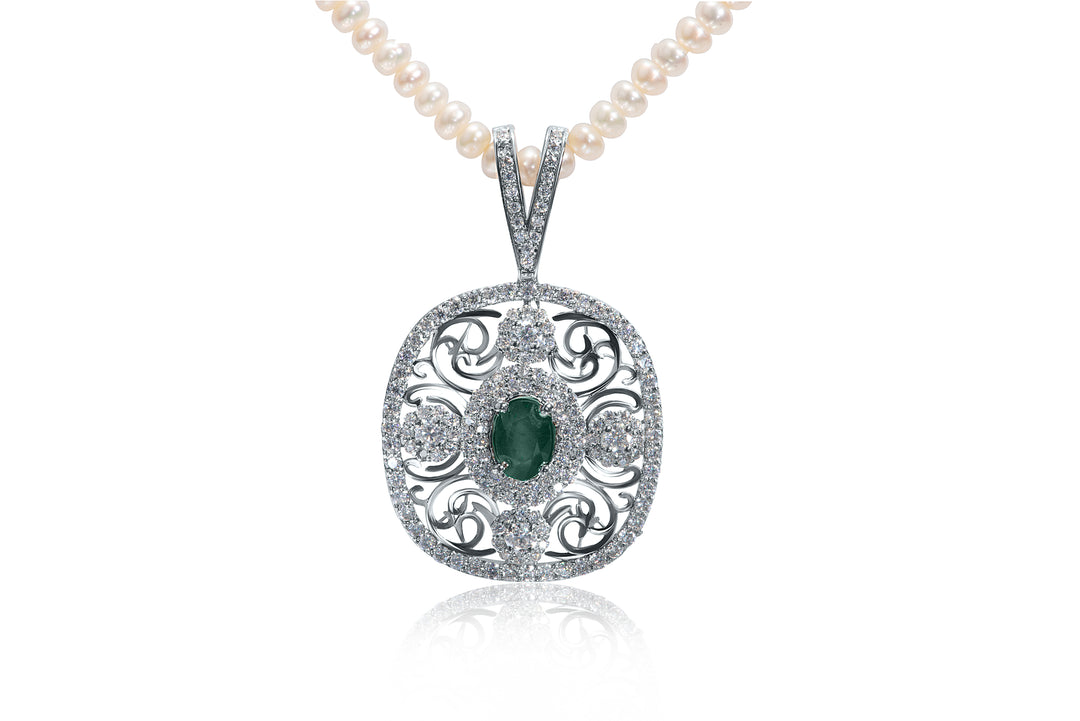 Close-up view of Zanvari’s emerald and moissanite pendant necklace with pearl string, handcrafted in sterling silver and rhodium plated.