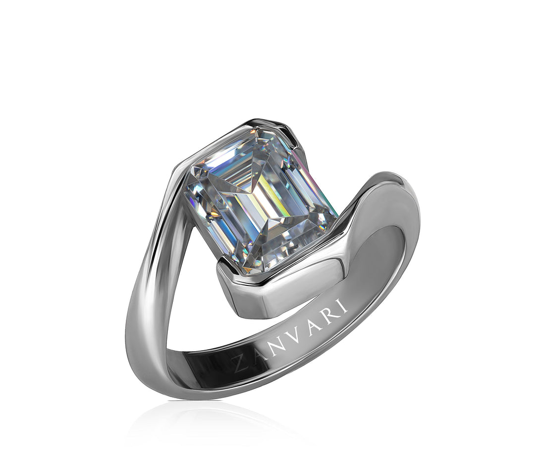 Silver ring with a large emerald moissanite  on a white background