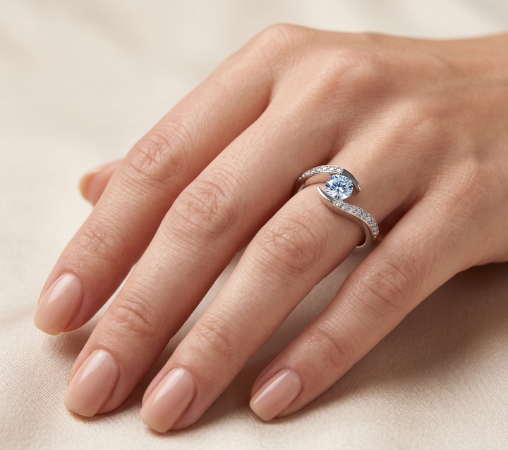 Hand wearing Glinted Glow by Zanvari Pakistan — 0.5 carat moissanite with accent moissanites in white gold-plated 925 sterling silver.