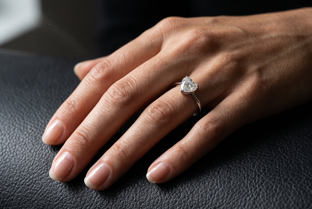 Model wearing heart shaped moissanite ring