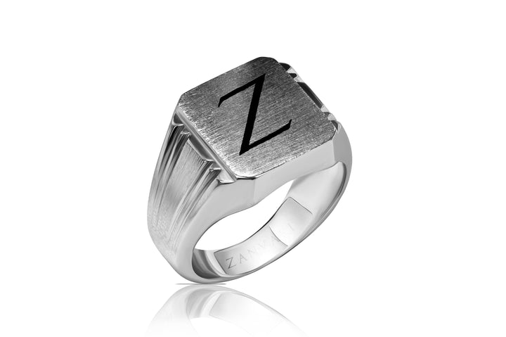 Silver signet ring with a engraved letter 'Z' on a white background