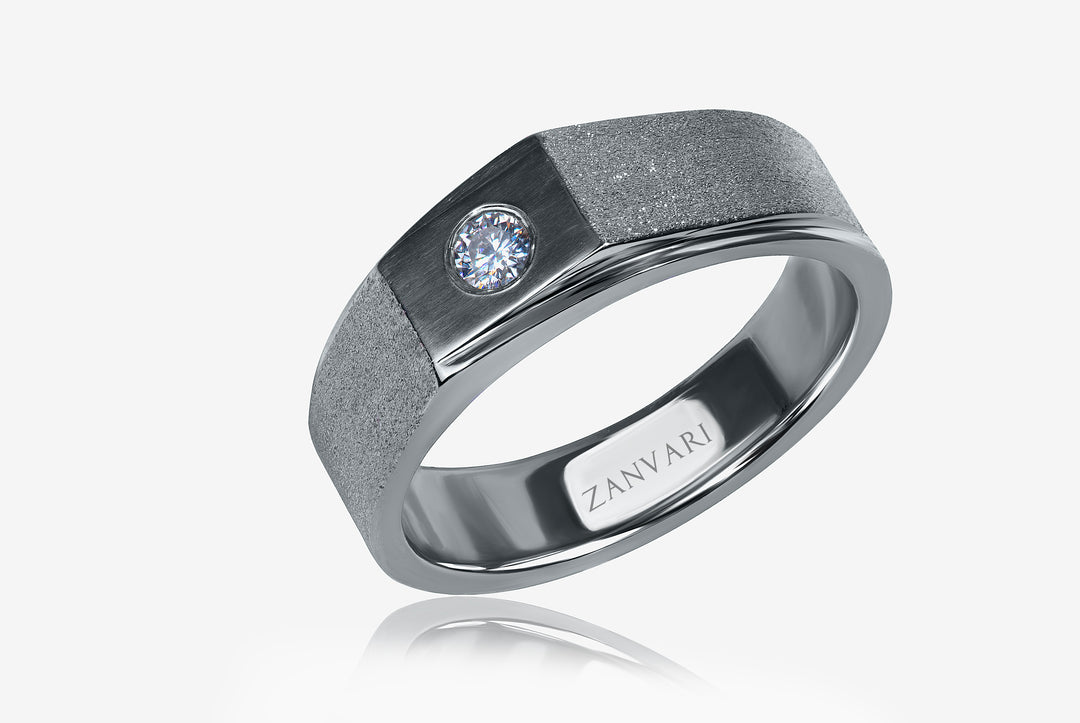 Silver ring with a moissanite and 'Zanvari' branding on a white background 