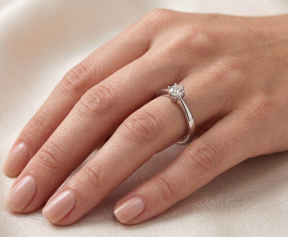 Hand wearing Moissy Magic by Zanvari Pakistan — 0.5 carat round brilliant moissanite proposal ring in 925 sterling silver.