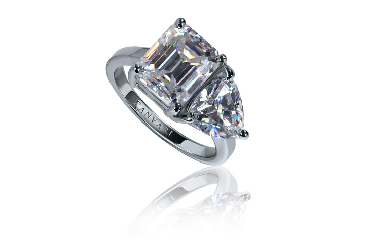 At its heart lies a 3-carat emerald cut moissanite, flanked by two triangular cut moissanites, each 1.5 carats, all set in solid 925 sterling silver. Toi et moi ring in silver