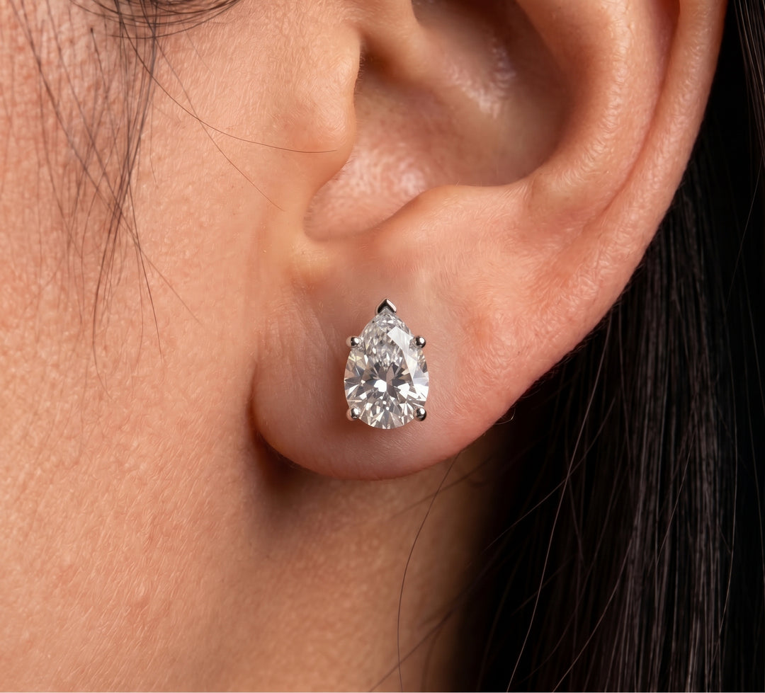 women wearing oval cut moissanite studs