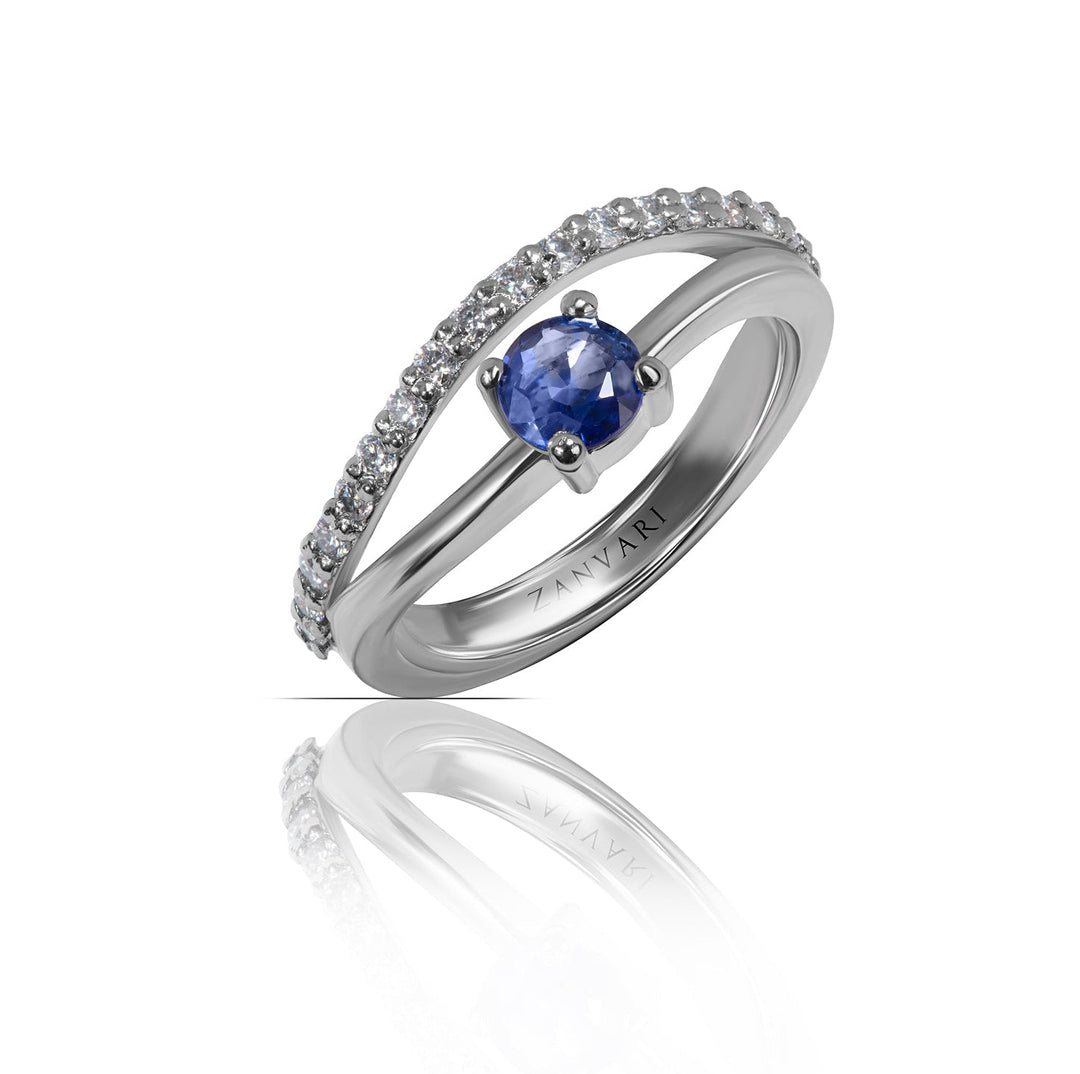 Ceylon Crescent sapphire ring — round natural Ceylon blue sapphire prong-set in a rhodium-plated 925 sterling silver split shank with a pavé moissanite crescent