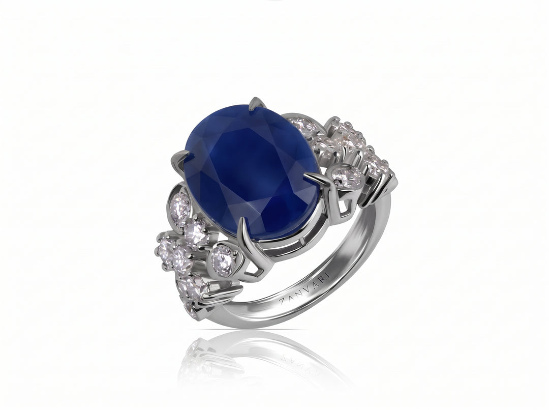 Product photography of natural sapphire with moissanite rin g in silver on white background
