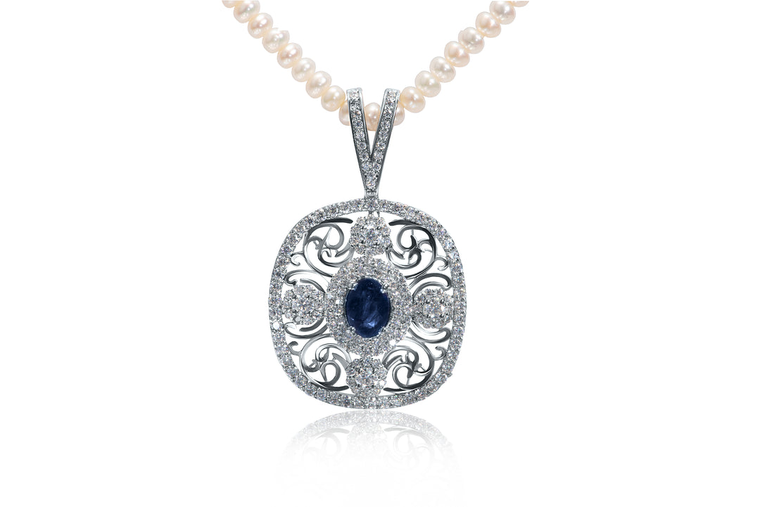 Close-up view of Zanvari’s sapphire and moissanite pendant necklace with pearl string, handcrafted in sterling silver and rhodium plated.