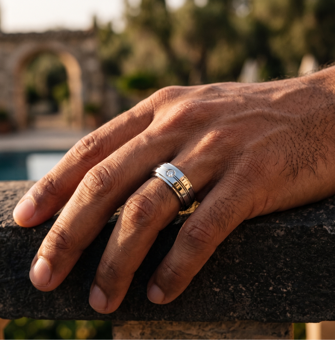Hand with a ring on a stone ledge with a blurred background