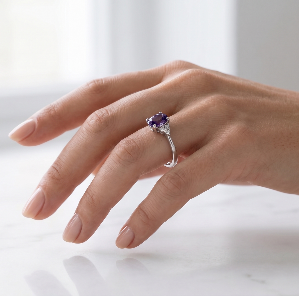 Hand wearing the Violet Whisper Ring by Zanvari Pakistan — deep purple natural amethyst in white gold-plated 925 sterling silver from the Jamun-e-Ishq collection.