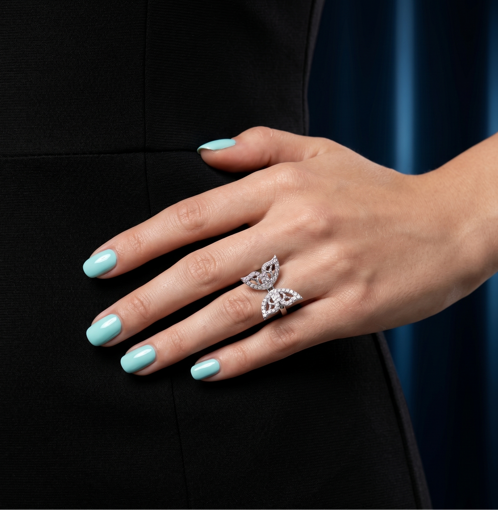 Butterfly moissanite ring in silver worn by a model