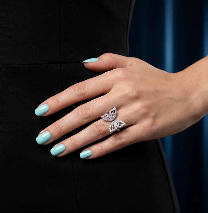 Butterfly moissanite ring in silver worn by a model
