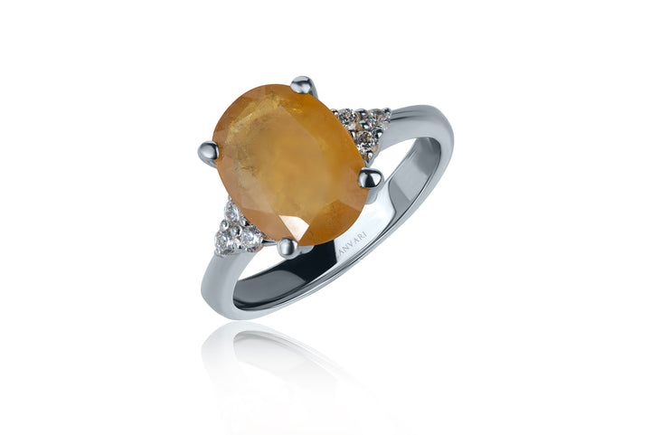 Silver ring with a yellow Sapphire gemstone on a white background crafted in silver handmade