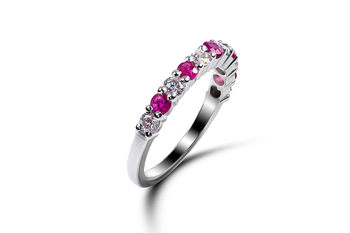 Gleam of Ruby and Moissanite Ring by Zanvari — alternating natural ruby and moissanite 2.75mm stones in a half-eternity band in 925 sterling silver, Pakistan.